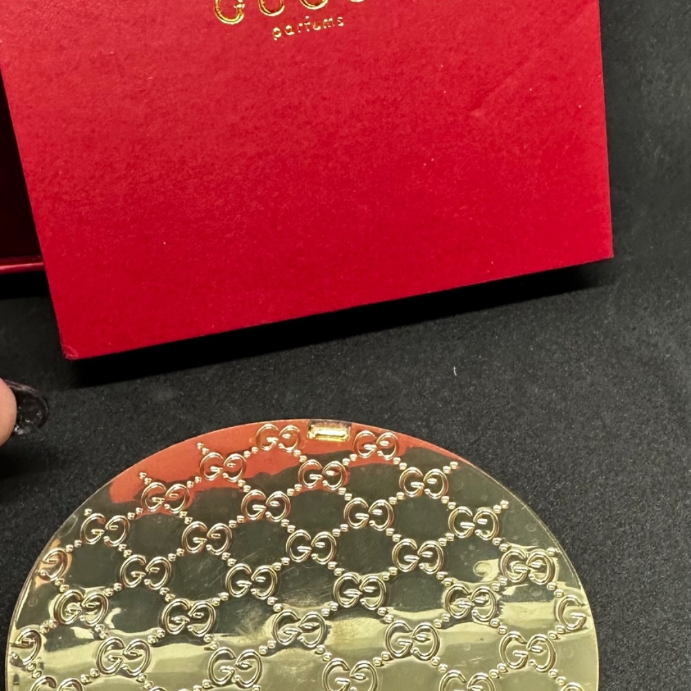 Gucci Beauty gold compact mirror